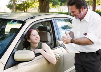 Girl in car with New York state driving instructor