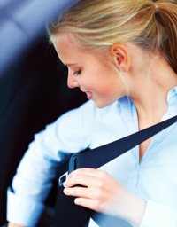 Woman wearing seat belt after completing online Texas seat belt course