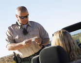 California motorist receiving speeding ticket from police officer